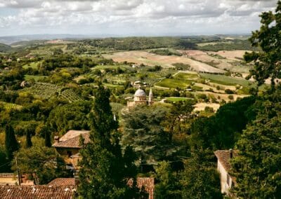 Tuscan countryside with trees, valleys and San Biagio