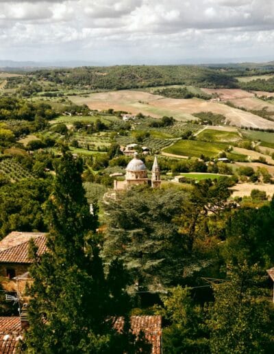 Tuscan countryside with trees, valleys and San Biagio