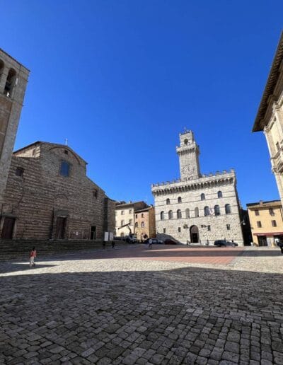 stone buildings with a tower in Piazza Grande, Montepulciano