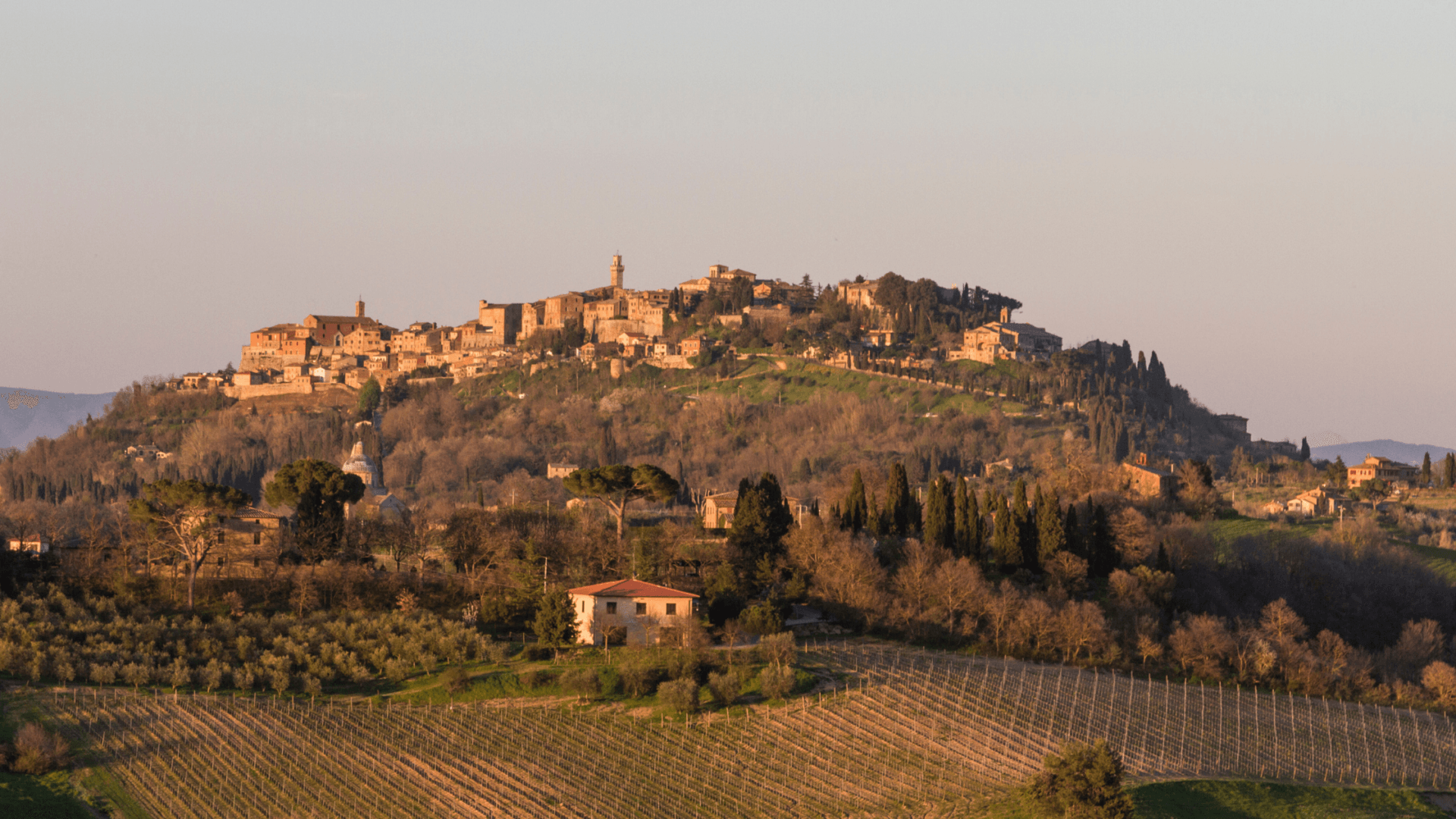 Tuscan countryside in Italy at sunset